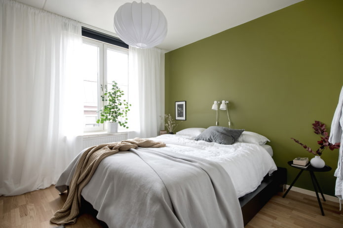 curtains in the bedroom interior in green tones