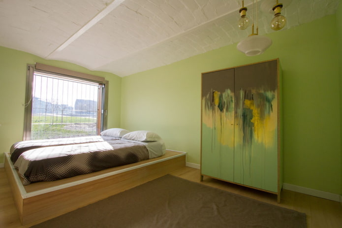 furniture in the interior of the bedroom in green tones