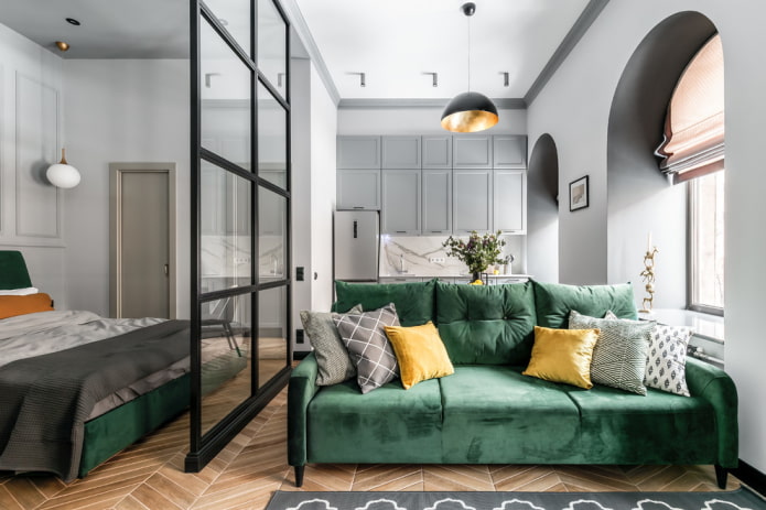 sofa with green fabric upholstery in the interior