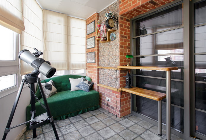 green sofa in the interior of the loggia