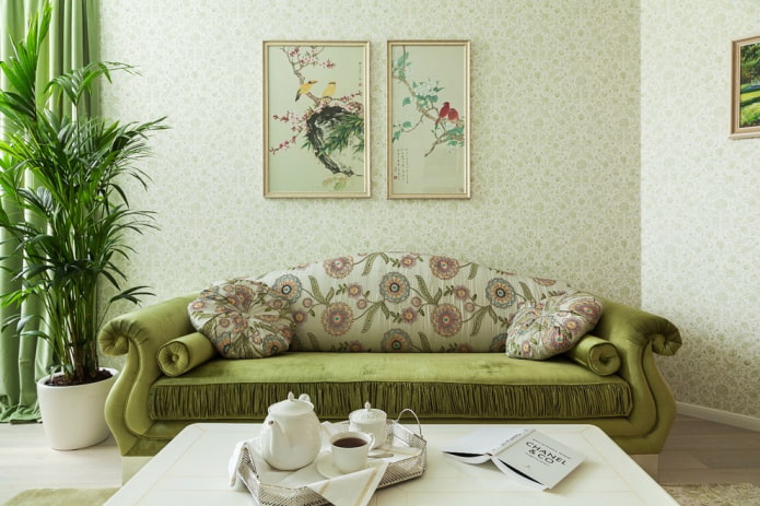 sofa with green upholstery with flowers in the interior
