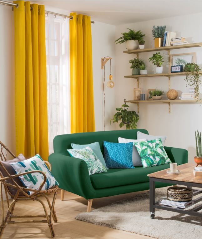 green sofa in combination with curtains