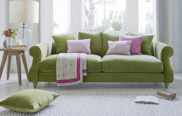 green sofa in combination with pillows