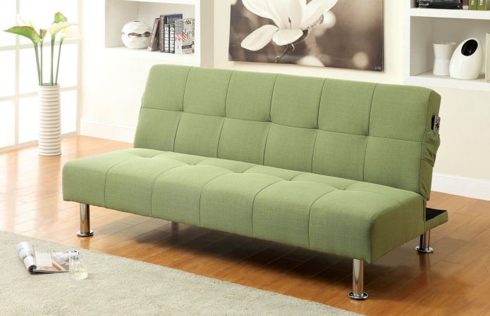 green folding sofa in the interior