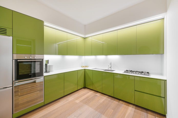 green corner glossy kitchen set in a modern style