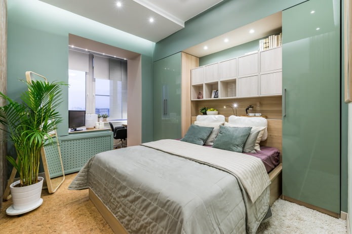 Green walls in the bedroom with a combined balcony