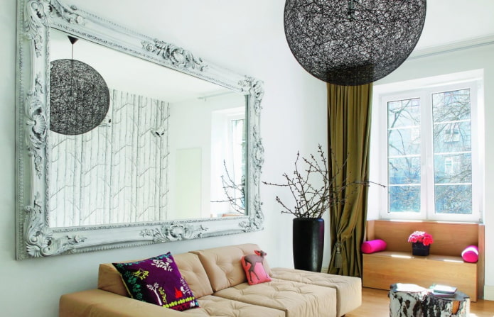 mirror in a frame in the interior of the hall