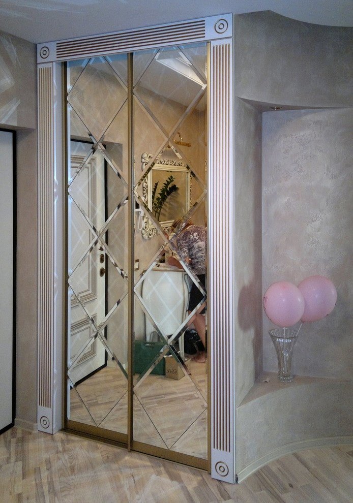 faceted mirror built into a wardrobe in the interior