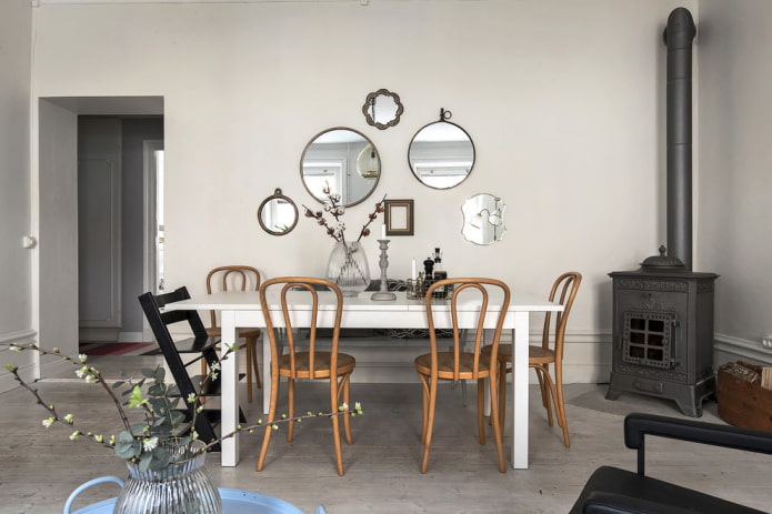 composition of mirrors on the wall in the interior of the dining room