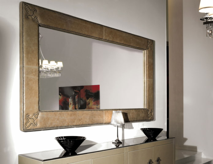 mirror in a leather frame in the interior of the hallway