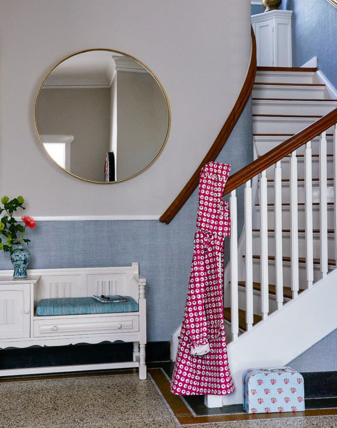 round mirror in the hallway interior