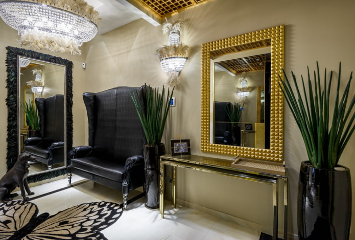 mirror in a golden frame in the interior of the hallway