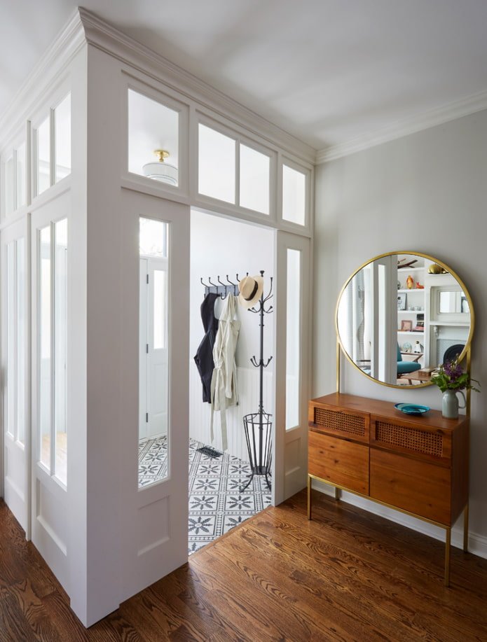 round mirror in the hallway interior