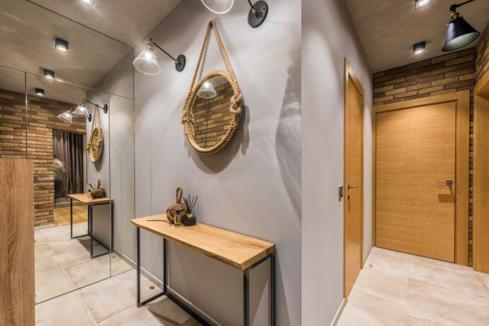 mirror with lamps in the interior of the hallway