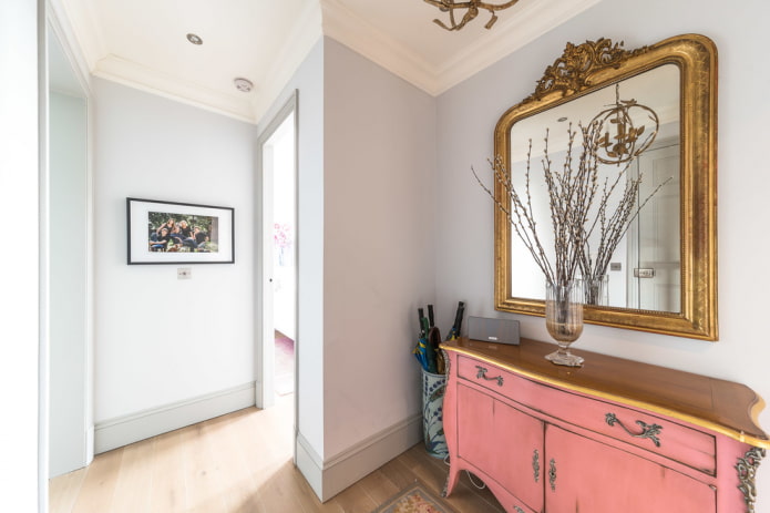 mirror in a baguette frame in the interior of the hallway