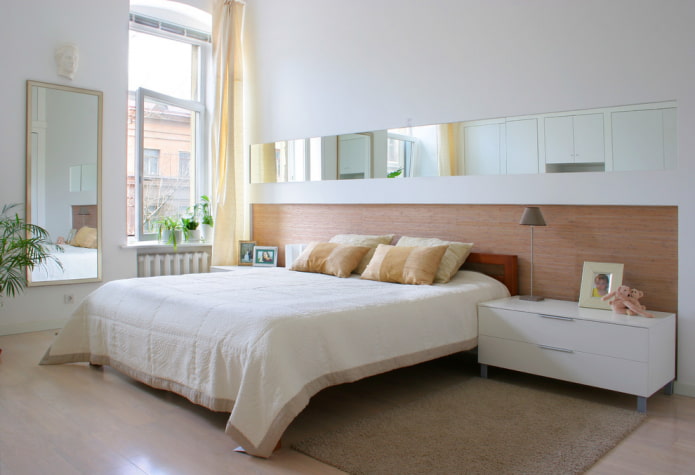 mirror mounted into a wall in the bedroom interior