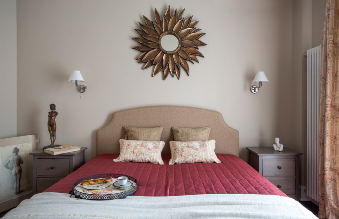 sun-shaped mirror in the bedroom interior