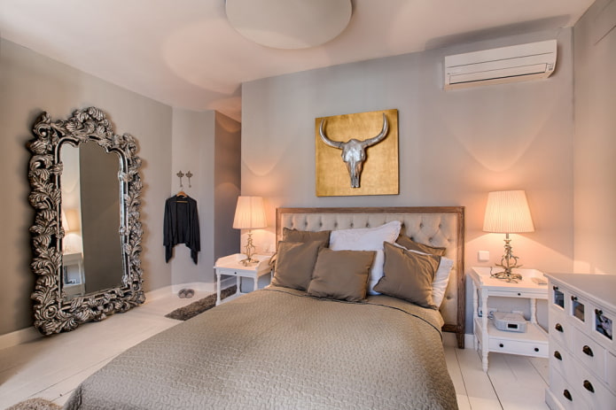 mirror in a silver frame in the bedroom interior