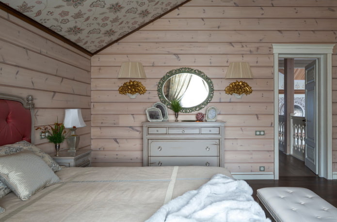 mirror with a sconce in the bedroom interior