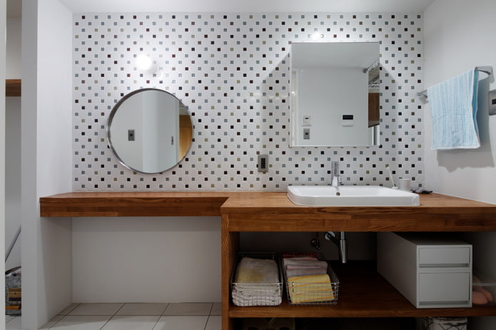 two mirrors on the wall in the bathroom interior