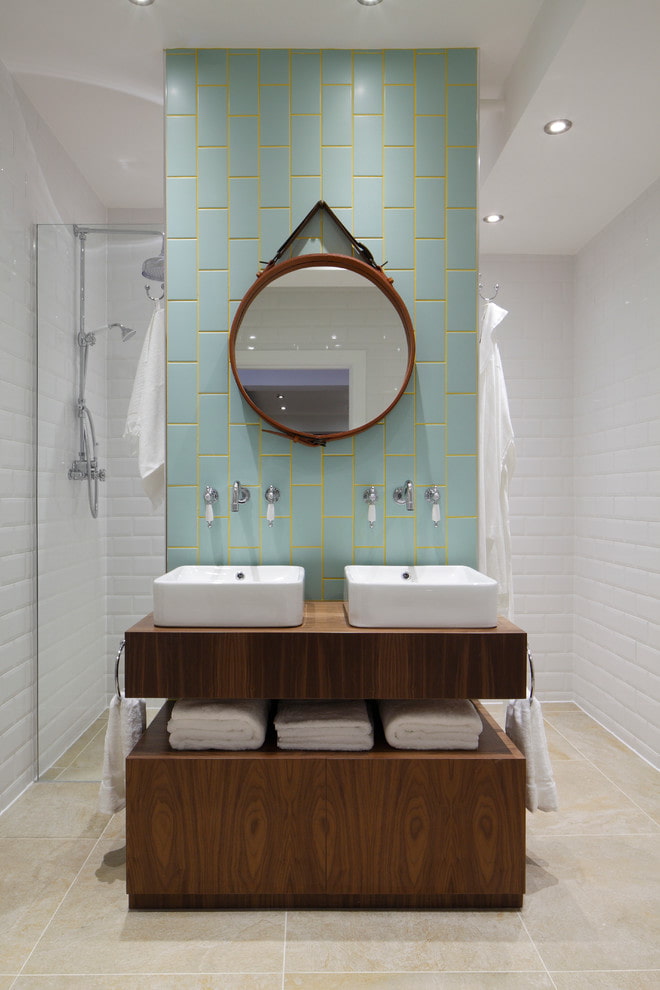 mirror above the sinks in the bathroom interior