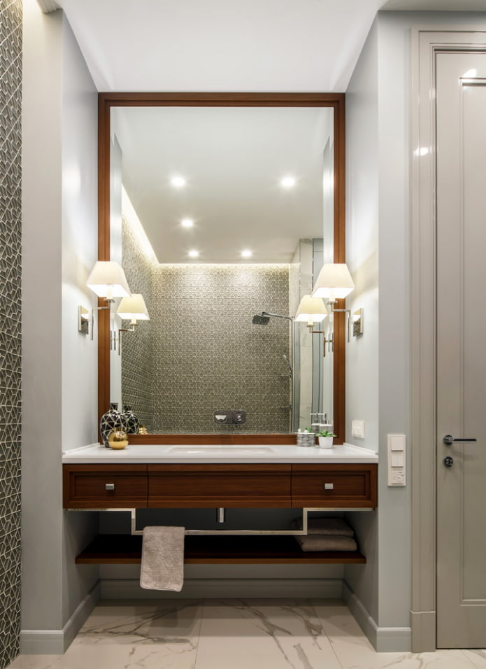 mirror with sconce in the bathroom interior