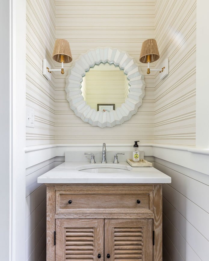 mirror with sconce in the bathroom interior