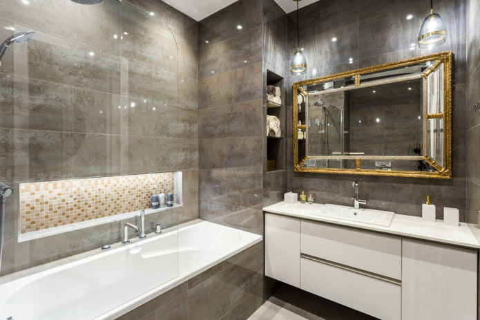 mirror in a golden frame in the bathroom interior
