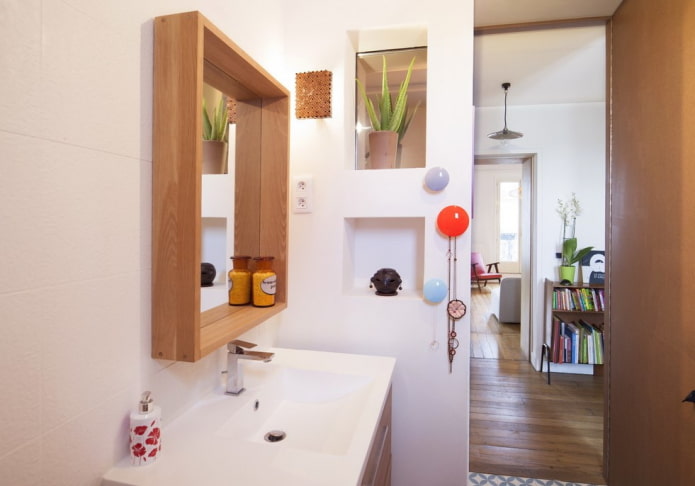 mirror with a shelf in the bathroom interior