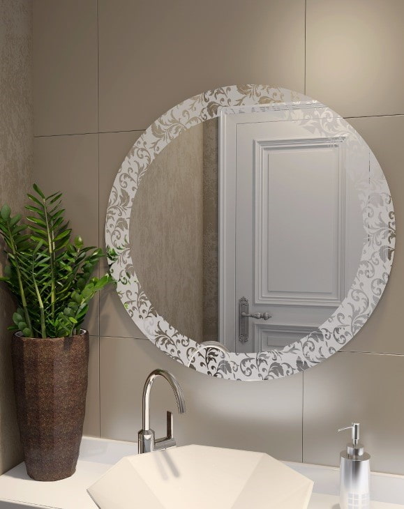 mirror with sandblasted design in the bathroom interior