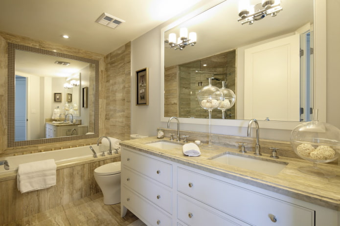 mirror above the bathtub in the bathroom interior
