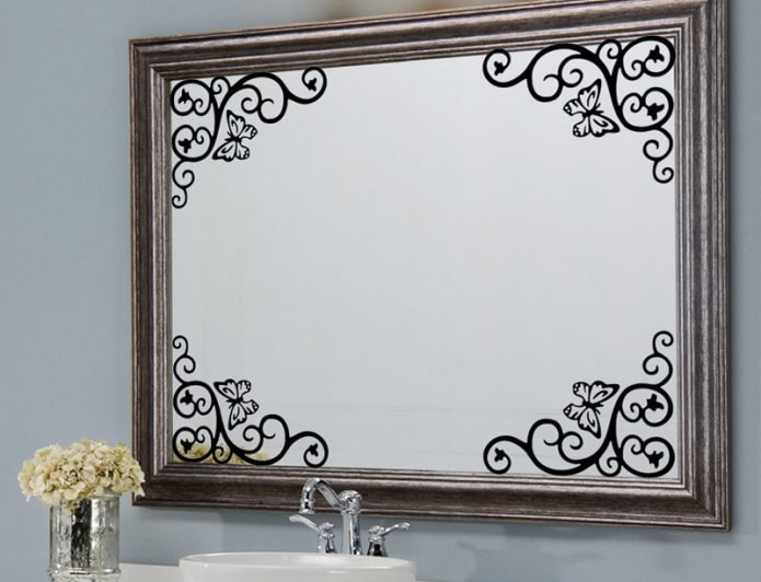mirror with stickers in the bathroom interior