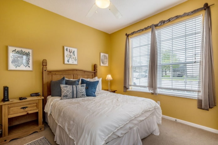 furniture in the interior of a bedroom in yellow tones