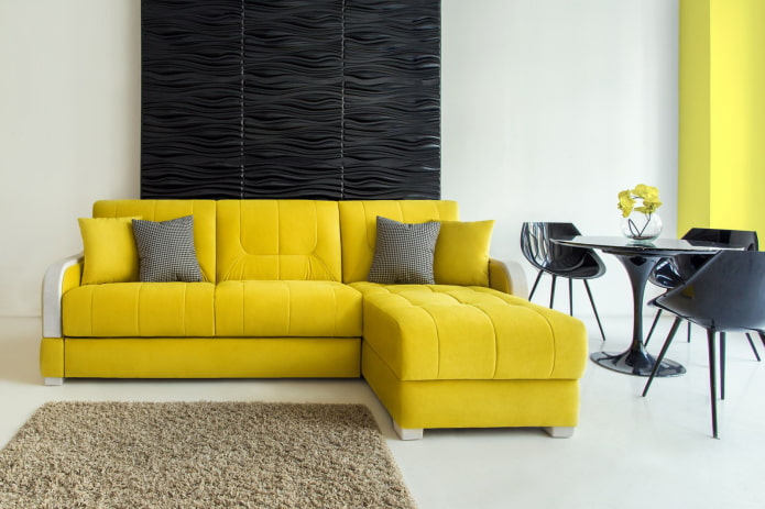 yellow sofa with an ottoman in the interior