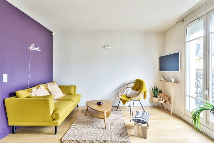 yellow sofa on legs in the interior