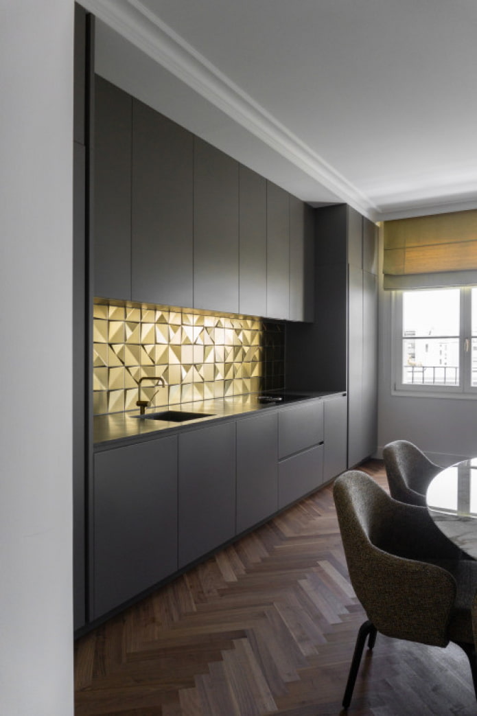 gold apron in a black kitchen
