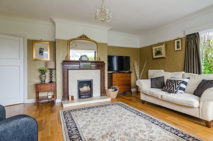 living room with gold walls and a fireplace