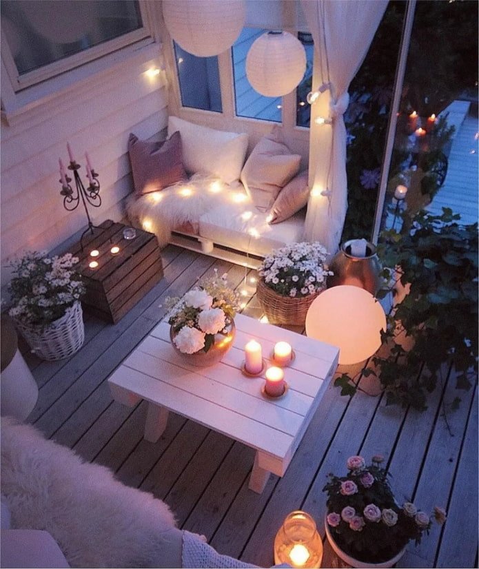 Garlands and candles on the balcony