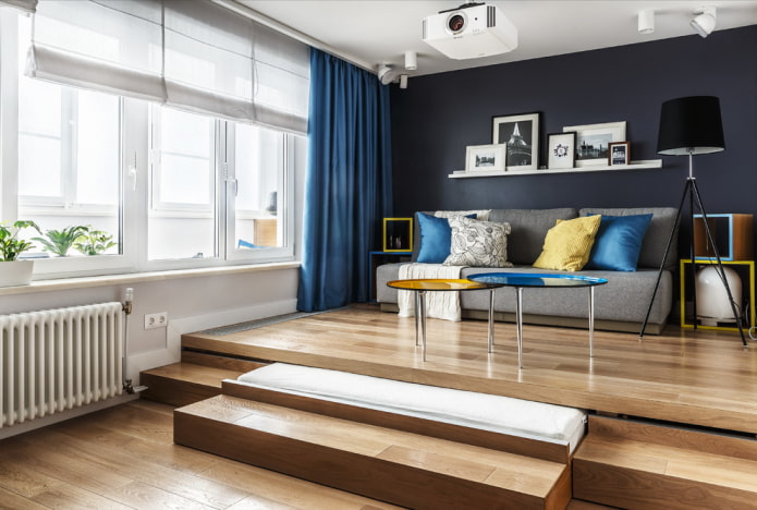 Living room with a podium and a bed