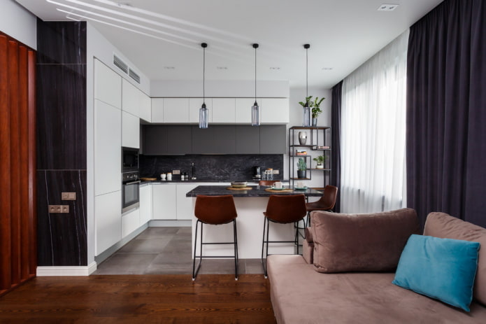 zoning with an island in the interior of the kitchen-living room