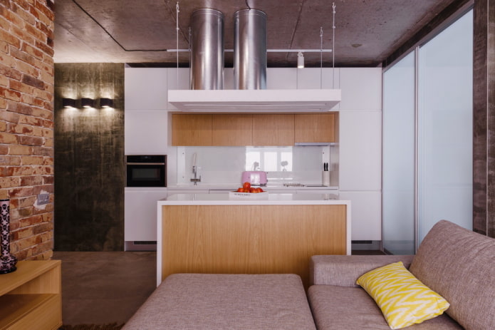 zoning with an island in the interior of the kitchen-living room