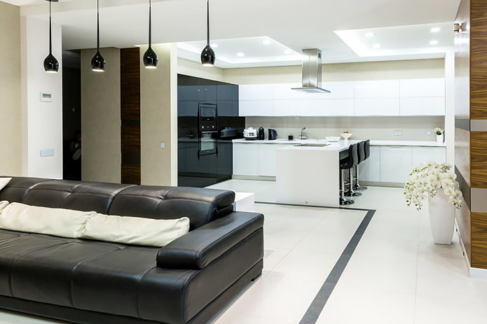 zoning with lighting in the interior of the kitchen-living room