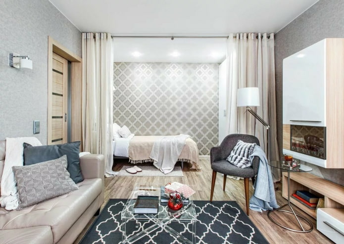 bedroom in a one-room apartment behind curtains